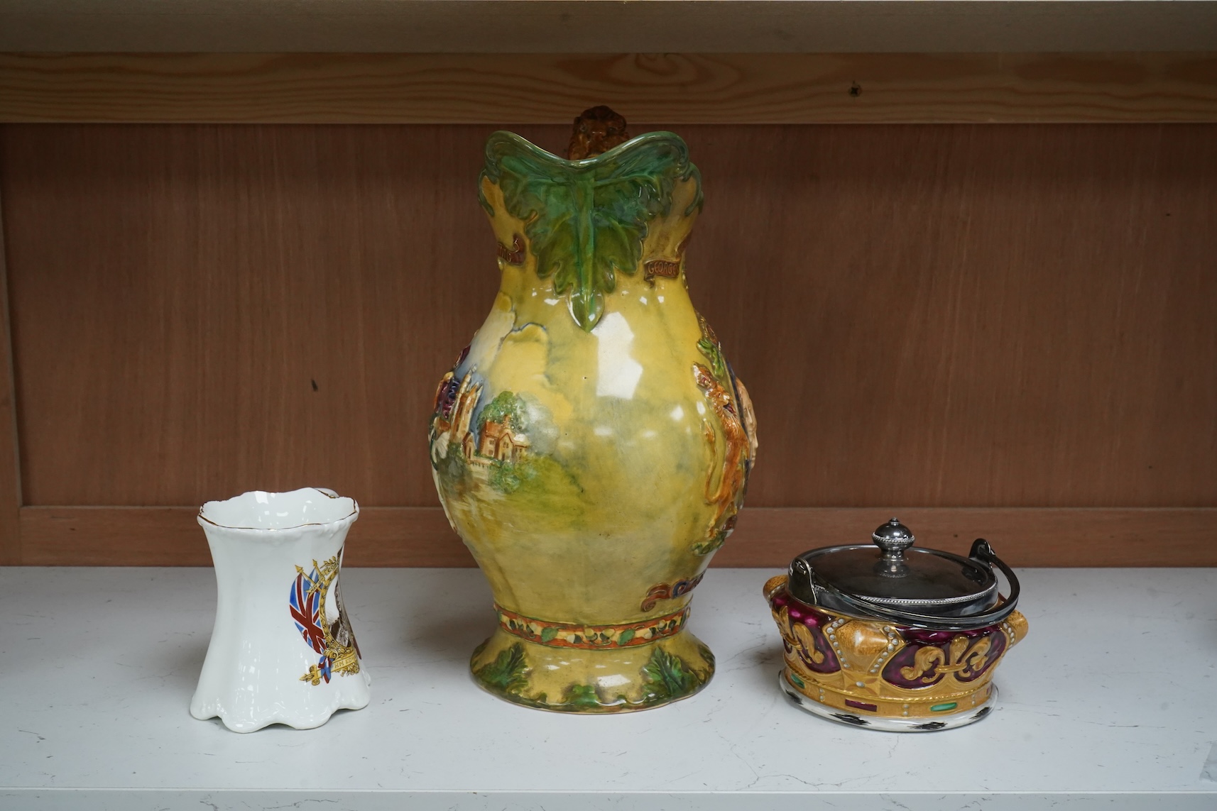 A Crown Devon George VI musical coronation jug, a crown shaped jar with plated cover and a coronation cup, largest 32cm high